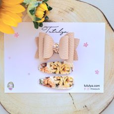 Light brown bow with matching barrettes